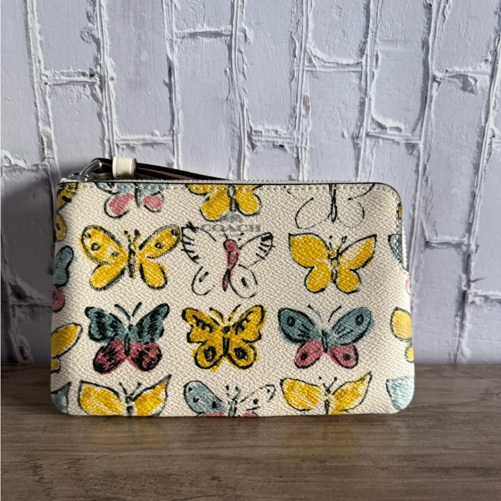 NWT Coach Women's Butterfly Print Corner Zip Wristlet yellow silver CAQ55